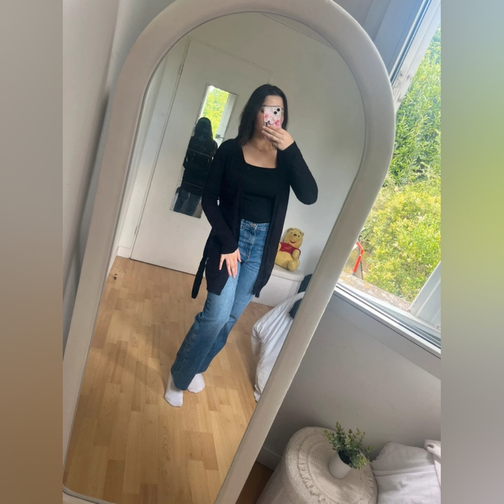 Black Cardigan and Blue Jeans